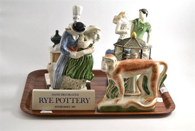 Lot 381 - Two Rye pottery figures of courting couples, a wedding group, baker, monkey and Rye pottery...