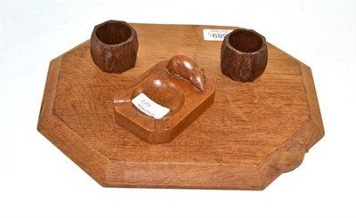 Lot 389 - Mouseman board, napkin rings and ashtray