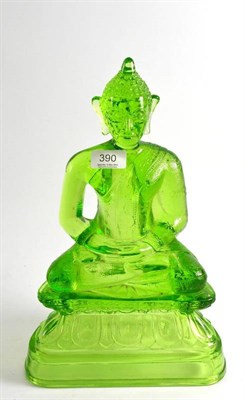 Lot 390 - An unusual North East pressed glass Buddha, on an ebonised light-up base