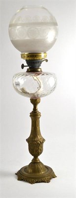 Lot 391 - An oil lamp with clear glass font and shade