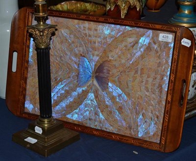 Lot 428 - A brass and ebony Corinthian column table lamp and a butterfly wing tray