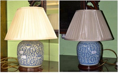 Lot 431 - A pair of Chinese blue and white table lamps and shades