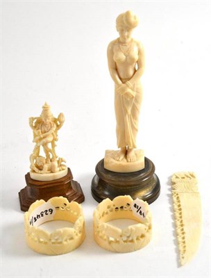 Lot 445 - Two ivory carved Oriental figures, one ivory paper knife with small carved elephants along the edge