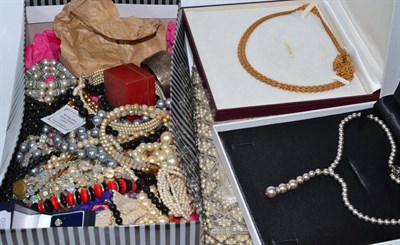 Lot 457 - Four boxes of costume jewellery including a silver bangle, assorted simulated pearls etc