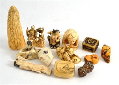 Lot 472 - An ivory okimono as a corn on the cob, another as a skull and ten other small netsukes