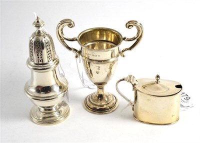 Lot 479 - Silver trophy cup, silver mustard and a silver caster (3)