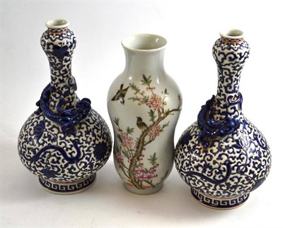 Lot 482 - A pair of Chinese blue and white enamelled double gourd vases and a bird decorated vase (3)