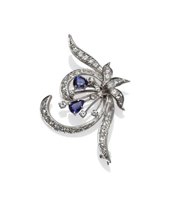 Lot 432 - A Diamond and Sapphire Spray Brooch, two pear cut sapphires within a frame set with round brilliant