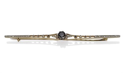 Lot 437 - A Sapphire and Diamond Bar Brooch, circa 1930, a central round mixed cut sapphire in a white...