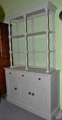 Lot 610 - A modern green painted pine dresser and rack