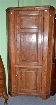 Lot 613 - Elm floor standing corner cupboard