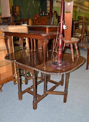 Lot 615 - An oak table, a mahogany coffee table, a nest of three tables, a hall chair, a standard lamp...