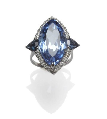 Lot 443 - An 18 Carat White Gold Synthetic Spinel, Sapphire and Diamond Ring, the marquise cut synthetic...