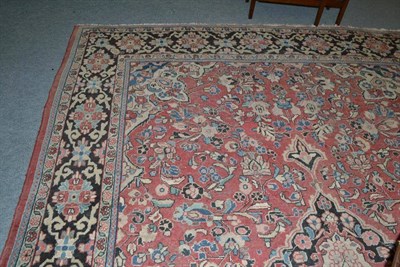 Lot 639 - A Mahal carpet, West Persia, the faded rose pink field with central medallion framed by...