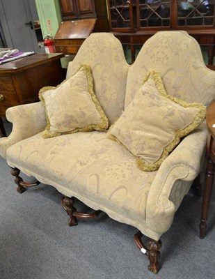 Lot 647 - A 17th century style hump back two seater settee with carved X stretcher