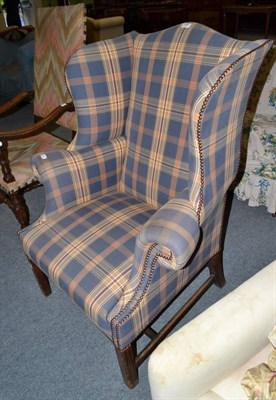 Lot 654 - Georgian style upholstered wing armchair