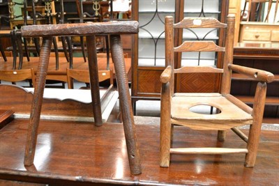 Lot 679 - Child's ladder back commode chair and an ash and elm stool (2)