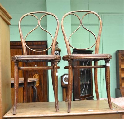 Lot 695 - Pair of bentwood chairs with parcel gilt decoration