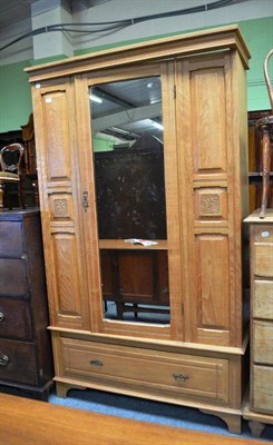 Lot 696 - An Edwardian satin birch wardrobe with central mirrored door and drawer below