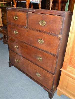 Lot 697 - An early 19th century oak chest of drawers