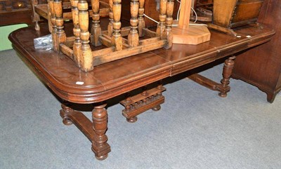 Lot 699 - A 19th century French oak extending dining table