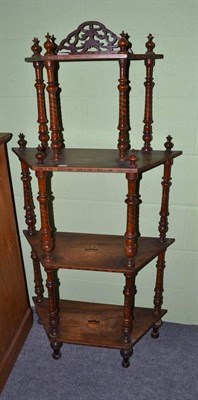 Lot 713 - An Edwardian four tier rosewood whatnot