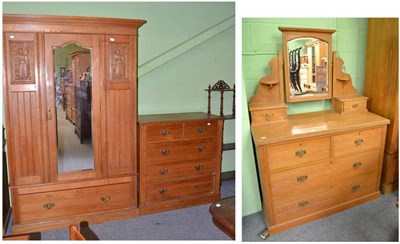 Lot 714 - An Edwardian three piece bedroom suite comprising wardrobe, chest of drawers and dressing table