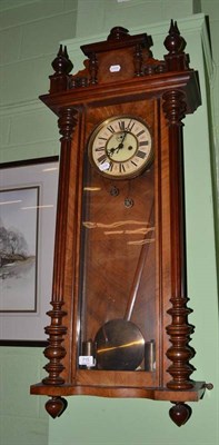 Lot 715 - A walnut cased Vienna style two weight wall clock