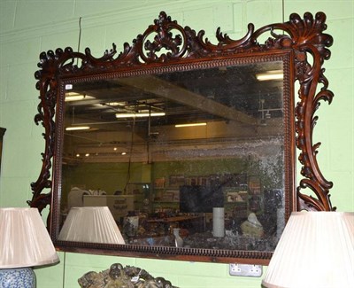 Lot 728 - A Victorian carved rosewood overmantel mirror with shell and scroll sides and top, width 160cm