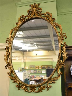 Lot 730 - A Rococo style gilt framed mirror