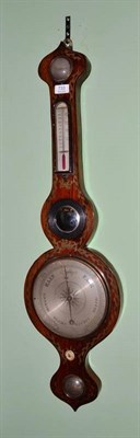 Lot 733 - A Regency rosewood wheel barometer with brass inlay, thermometer and hydrometer