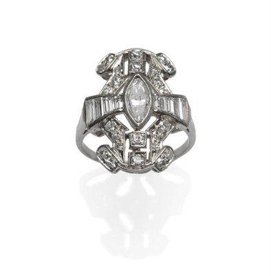 Lot 459 - A Diamond Plaque Ring, a marquise cut diamond centrally within a border of graduated baguette...