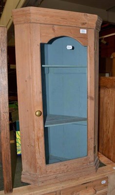 Lot 835 - A stripped pine corner cabinet