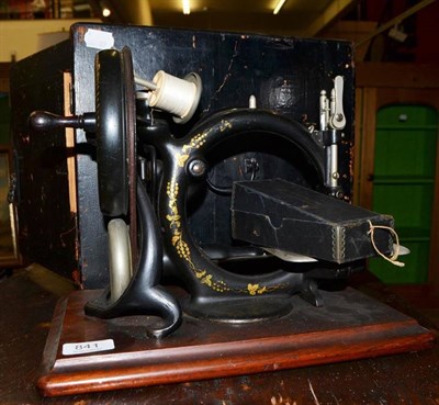 Lot 841 - A Willcox & Gibbs swan neck sewing machine and case