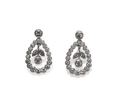 Lot 465 - A Pair of Diamond Drop Earrings, a round brilliant cut diamond in a white collet setting,...