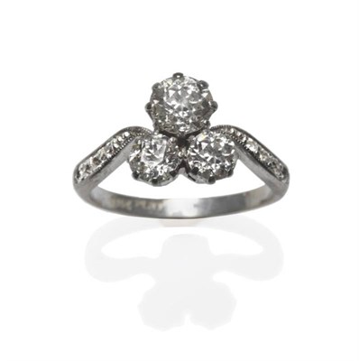 Lot 471 - A Diamond Cluster Ring, circa 1930, three old cut diamonds in white claw settings clustered to...