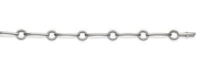 Lot 472 - A Diamond Set Bracelet, by Chimento, curved plain polished white bars spaced with loops inset...