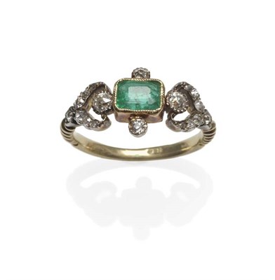 Lot 476 - An Emerald and Diamond Ring, the central emerald-cut emerald in a yellow millegrain setting,...