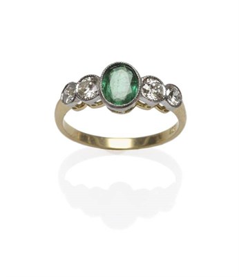 Lot 477 - An Emerald and Diamond Five Stone Ring, an oval mixed cut emerald flanked by two brilliant cut...