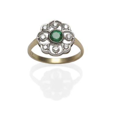 Lot 481 - An Emerald and Diamond Cluster Ring, the round brilliant cut emerald within an openwork border...