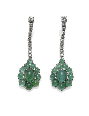 Lot 486 - A Pair of 18 Carat White Gold Emerald and Diamond Drop Earrings, a round brilliant cut diamond...