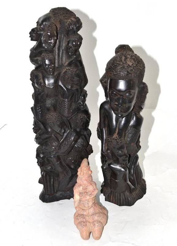 Lot 21 - A pair of Makonde ebony figures and a resin figure