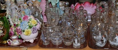 Lot 25 - Three trays including a collection of Victorian clear glass and enamel ewers, bisque figures, etc