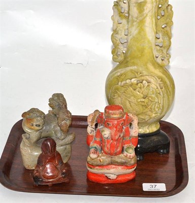 Lot 37 - A Chinese green soapstone vase, a dog of Fo, an Indian alabaster elephant god and soapstone Buddha