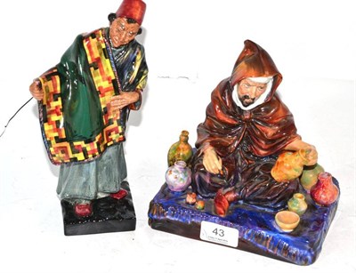 Lot 43 - Two Royal Doulton figures - ";The Potter"; HN1493 and ";Carpet Seller"; HN1464