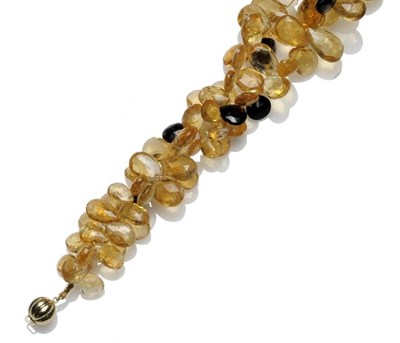 Lot 501 - A Citrine and Onyx Necklace, two strands of briolette citrine strung with briolette onyx at...