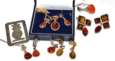 Lot 86 - A 9ct gold amber pendant on chain, a pair of amber drop earrings, three pairs of amber...
