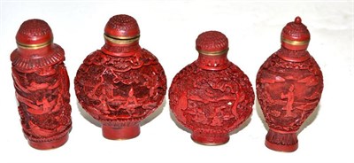 Lot 93 - Four late 19th century cinnabar lacquer snuff bottles with stoppers and spoons
