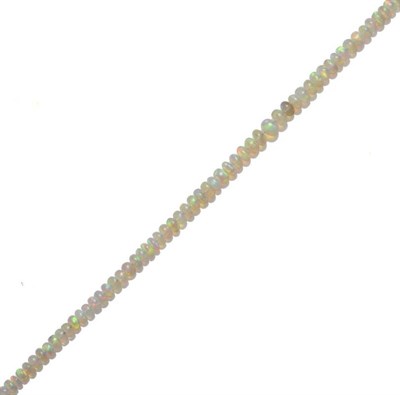 Lot 504 - An Opal Bead Necklace, graduated polished beads strung to a hook catch, length 48.5cm