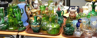 Lot 111 - Three trays including a collection of Victorian coloured glass and enamel ewers, vases, etc